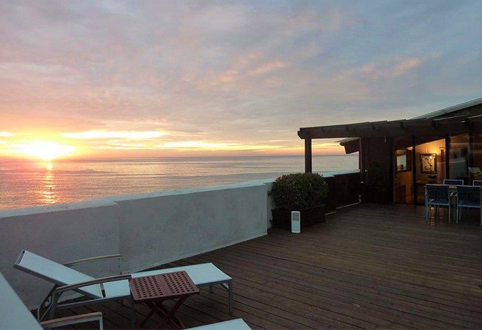 Estela Barcelona gay-friendly hotel terrace view at sunset. Ocean view from hotel. Gay travel advice for Barcelona.