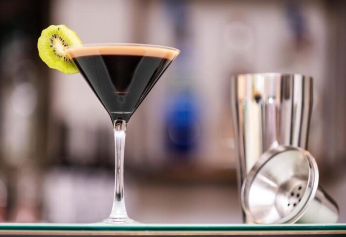 Eurostars Budapest Center gay-friendly hotel bar: Martini cocktail with kiwi garnish and shaker. Enjoy Budapest's nightlife.