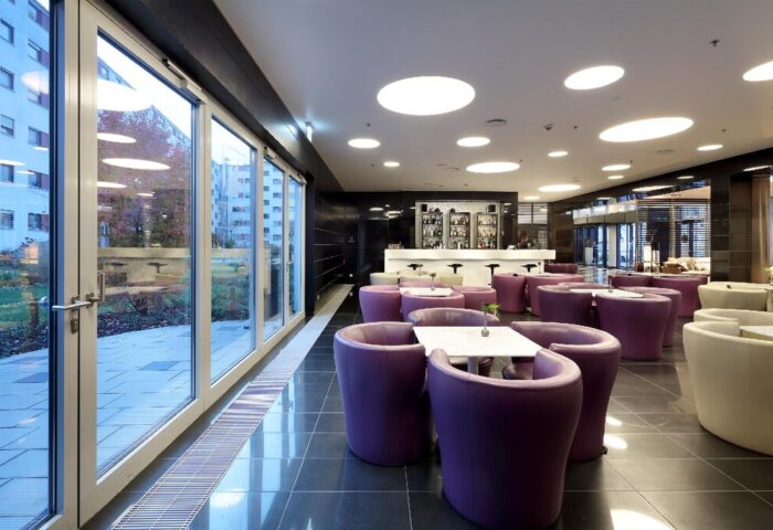 Eurostars Grand Central Hotel's stylish bar area. This gay-friendly hotel features modern design, comfortable seating, and a welcoming atmosphere.