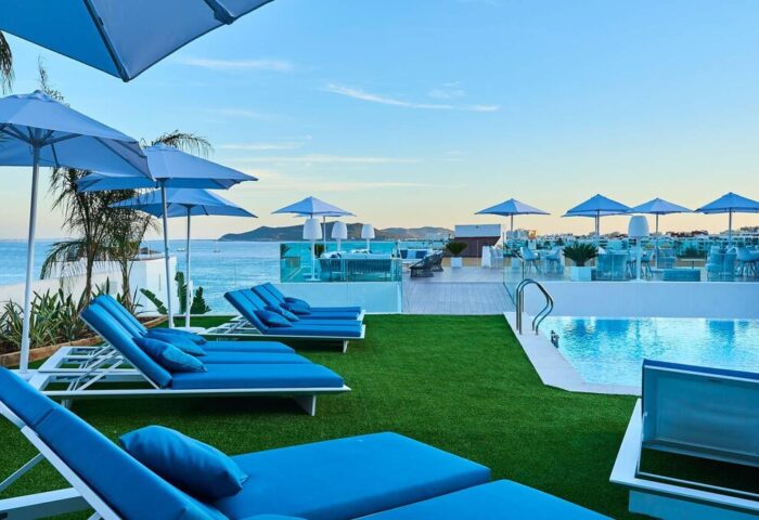 Eurostars Ibiza, a gay-friendly hotel. Rooftop pool, sun loungers, and ocean views. A great spot for gay travel and relaxation.