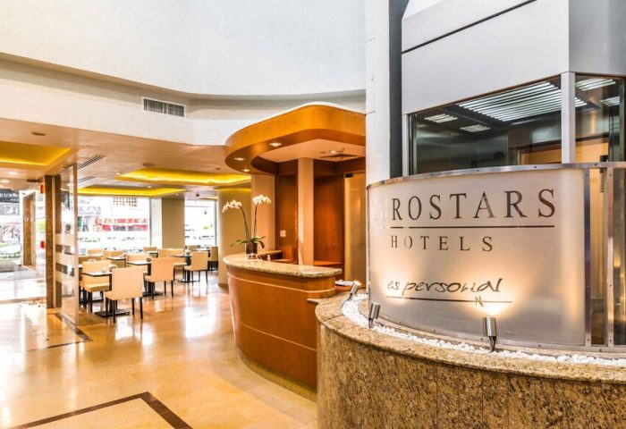 Eurostars Zona Rosa Suites lobby. Gay-friendly hotel in Mexico City's Zona Rosa, featuring a reception desk and dining area.