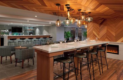 Fairfield by Marriott Montreal Downtown bar area. Gay-friendly hotel with stylish seating, bar, and modern design. Perfect for gay travelers.
