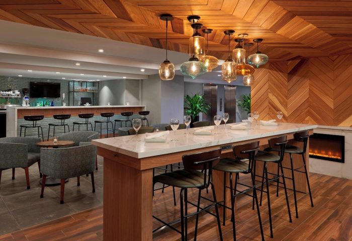Fairfield by Marriott Montreal Downtown bar area. Gay-friendly hotel with stylish seating, bar, and modern design. Perfect for gay travelers.