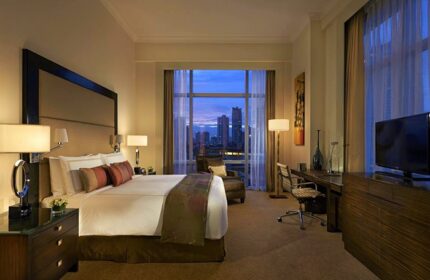 Fairmont Makati hotel room with city view. Gay-friendly hotel with restrictions in Makati, Philippines. Luxurious travel for gay men.