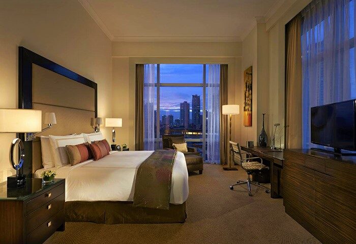 Fairmont Makati hotel room with city view. Gay-friendly hotel with restrictions in Makati, Philippines. Luxurious travel for gay men.