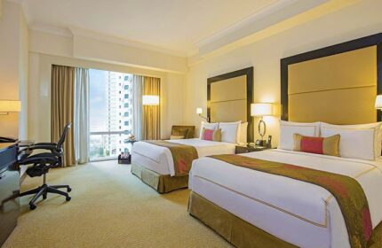 Fairmont Makati hotel room with two beds. Gay-friendly hotel in Makati with city view. Luxury hotel for gay men with restrictions.