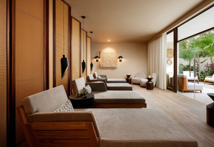 Gay-friendly Fairmont Mayakoba hotel spa. Loungers, modern lighting, and a relaxing outdoor patio. A luxury travel destination for gay men.