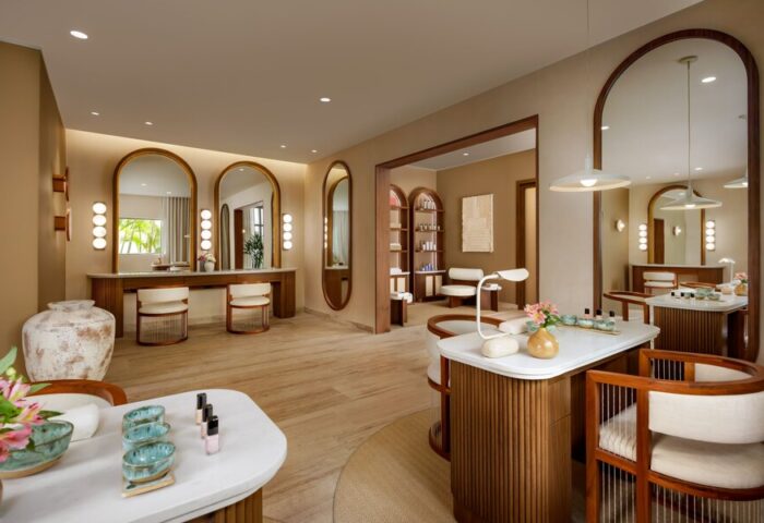 Fairmont Mayakoba's gay-friendly spa. Interior with vanity mirrors and seating. A luxury travel destination for gay men seeking relaxation.