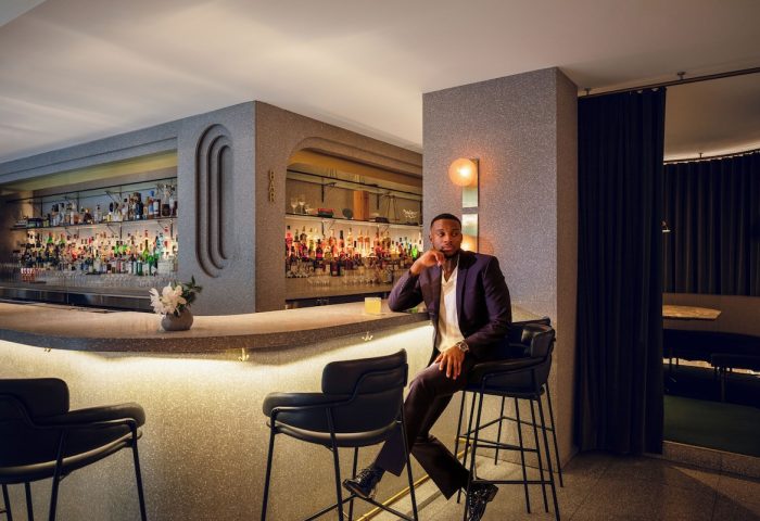 Fairmont Pacific Rim Hotel gay bar. Man at the bar in this gay-friendly hotel. Vancouver gay travel advice. Upscale hotel bar.