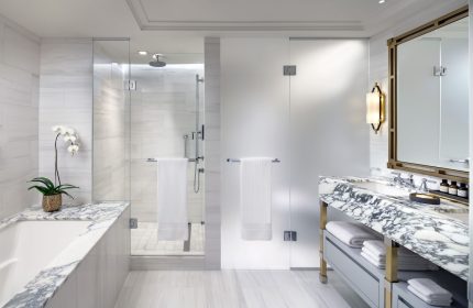 Fairmont Royal York gay-friendly hotel bathroom. Glass shower, marble vanity, and modern fixtures. Upscale accommodations for gay travelers.