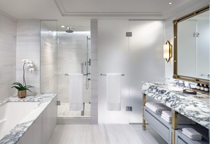 Fairmont Royal York gay-friendly hotel bathroom. Glass shower, marble vanity, and modern fixtures. Upscale accommodations for gay travelers.