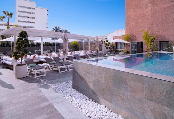 Fenix Torremolinos Adults Only: Pool area with sunbeds. Gay-friendly hotel recommended for its relaxing atmosphere and modern design.