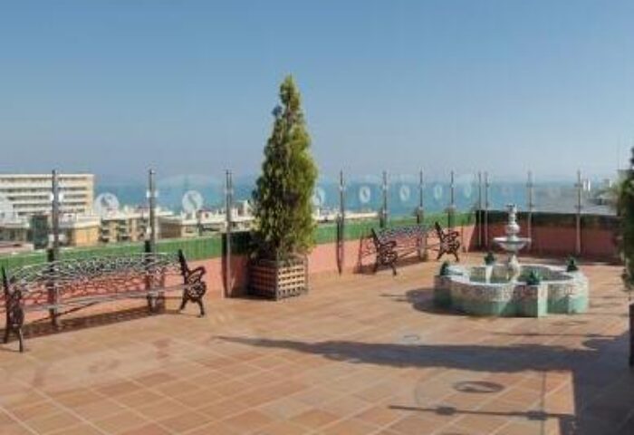 Fenix Torremolinos Adults Only hotel rooftop terrace with benches, fountain, and sea view. Gay-friendly recommended hotel for gay men travelers.