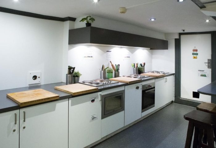 Flying Pigs Downtown Hostel Amsterdam kitchen. Gay-friendly hotel with cooking facilities for budget travelers. Shared kitchen space.