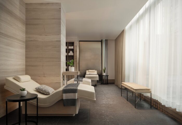 Four Seasons Hotel Toronto at Yorkville spa. Gay-friendly hotel with massage beds, soft lighting, and neutral tones for relaxation.