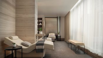 Four Seasons Hotel Toronto at Yorkville spa. Gay-friendly hotel with massage beds, soft lighting, and neutral tones for relaxation.