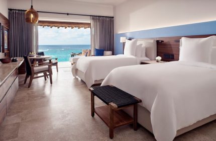 Four Seasons Resort Punta Mita gay-friendly hotel room. Two beds, ocean view, and modern decor. Ideal for gay travelers seeking luxury.