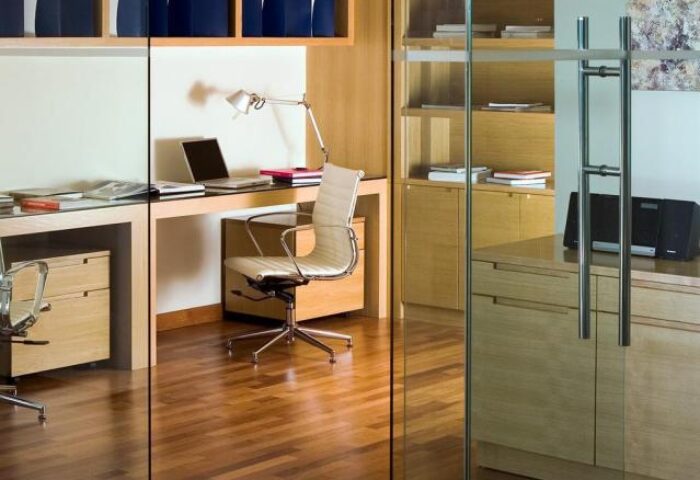 Fraser Place Kuala Lumpur office. Gay-friendly hotel room with desk, chair, and laptop. Modern design for comfortable work. Kuala Lumpur hotel.