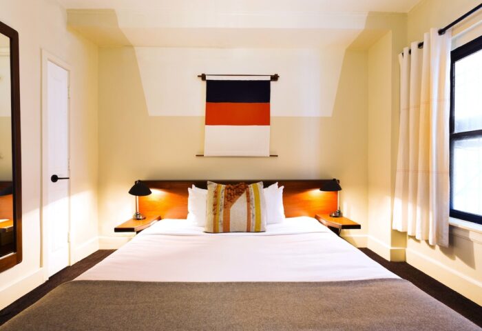 Freehand Chicago hotel room. Gay-friendly travel lodging with bed, lamps, and modern decor. A comfortable stay in Chicago.