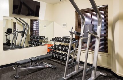 Freehand Chicago gay-friendly hotel gym. Weight rack, bench, pull-up station, and TV. A great place to workout while traveling.