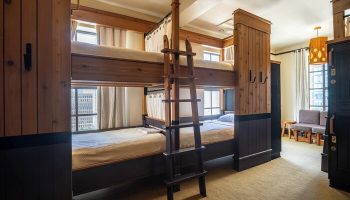 Freehand Los Angeles gay-friendly hotel room with bunk beds, ladder, curtains, and city views. A great choice for gay travel to Los Angeles.