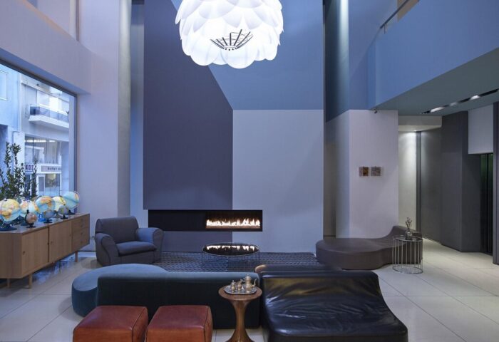 Fresh Hotel's gay-friendly interior. Modern design with fireplace, globes, and stylish furniture. A welcoming space for gay travelers.