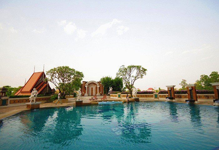 Furama Chiang Mai gay-friendly hotel pool. Relaxing swimming pool area with statues and architecture. A great spot for gay travelers.