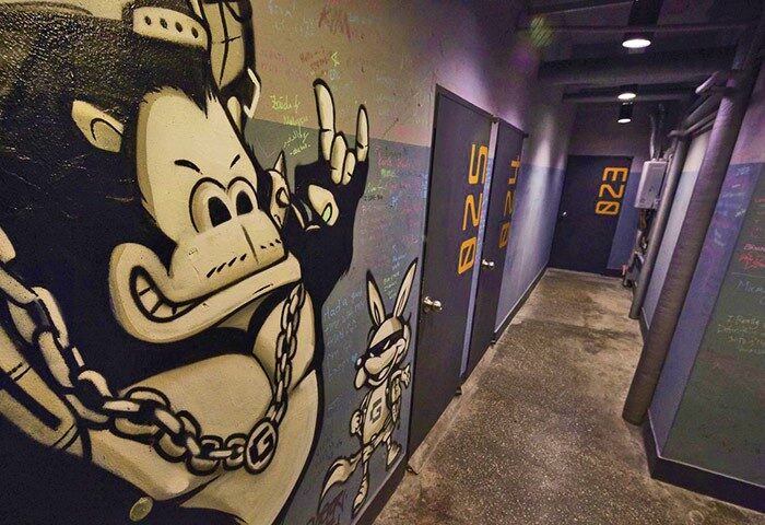 Hallway at G Guesthouse Itaewon in Seoul. Graffiti art of a gorilla and rabbit on the wall. Gay-friendly hotel with unique design elements.