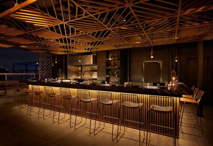 Bar area at Gansevoort Meatpacking NYC, a gay-friendly hotel. Features modern design, stylish seating, and a sophisticated ambiance.