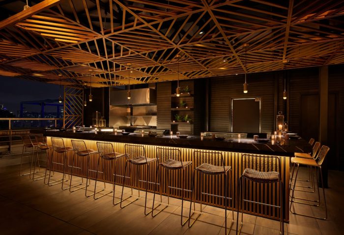 Bar area at Gansevoort Meatpacking NYC, a gay-friendly hotel. Features modern design, stylish seating, and a sophisticated ambiance.