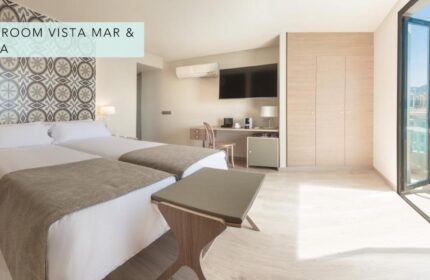 Gastrohotel Boutique RH Canfali gay-friendly hotel room with twin beds, desk, and sea view balcony. Ideal for gay travelers.