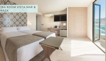 Gastrohotel Boutique RH Canfali gay-friendly hotel room with twin beds, desk, and sea view balcony. Ideal for gay travelers.