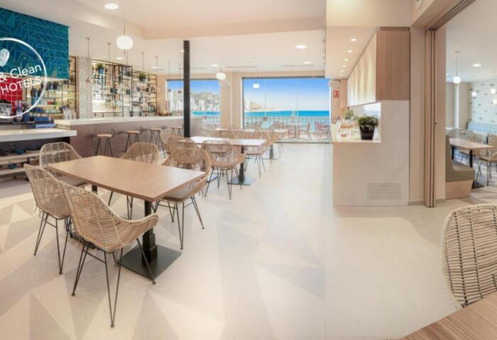 Gastrohotel Boutique RH Canfali restaurant. Tables and chairs face the sea. Gay-friendly hotel with bar and dining. Safe & Clean Hotel.