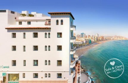 Gastrohotel Boutique RH Canfali, a gay-friendly hotel. Exterior view of the hotel overlooking the beach and city. Coastal gay travel.