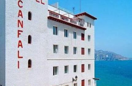 Gastrohotel Boutique RH Canfali, a gay-friendly hotel. Exterior view of the white building with red lettering, near the sea.
