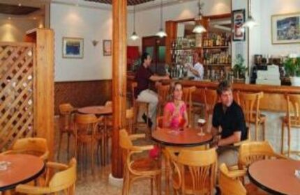 Gastrohotel Boutique RH Canfali's bar area. Gay-friendly hotel with a relaxed atmosphere, bar service, and comfortable seating. Ideal for gay travelers.
