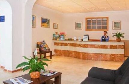 Gastrohotel Boutique RH Canfali's lobby. Reception area with staff, seating, and tourist information. Gay-friendly hotel interior.
