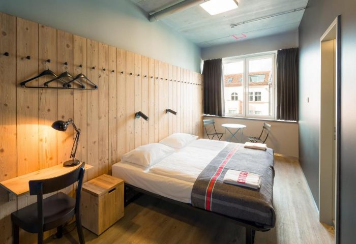 Generator Berlin Mitte: Gay-friendly hotel room. Double bed, desk, and window seating. Modern, minimalist design for gay travelers in Berlin.