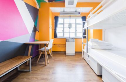 Generator London gay-friendly, pet-friendly hotel room. Bunk beds, desk, and colorful wall art. Modern hostel for LGBTQ+ travelers.