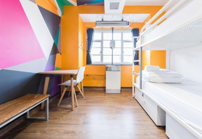 Generator London gay-friendly, pet-friendly hotel room. Bunk beds, desk, and colorful wall art. Modern hostel for LGBTQ+ travelers.