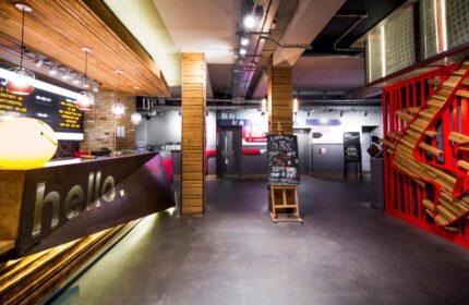 Generator London's lobby. This gay-friendly, pet-friendly hotel features a stylish reception area with a hello sign and modern design.