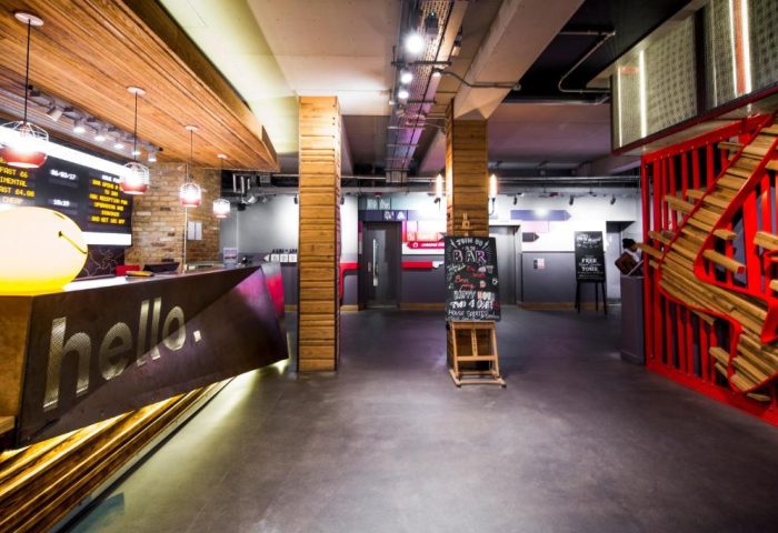 Generator London's lobby. This gay-friendly, pet-friendly hotel features a stylish reception area with a hello sign and modern design.