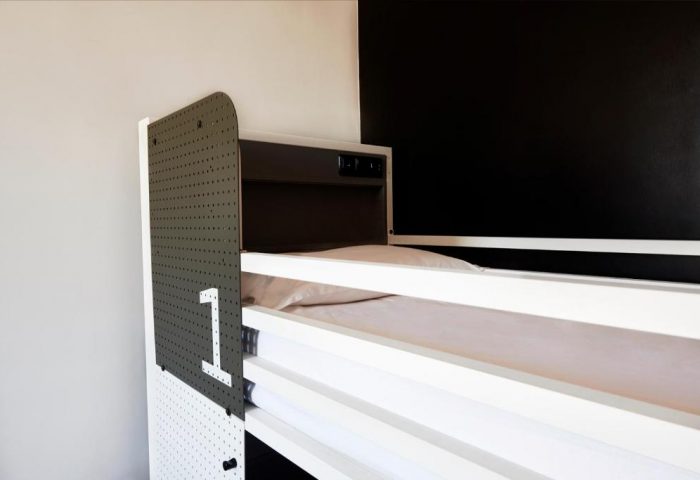 Generator Rome gay-friendly hotel: Modern bunk bed with number one. Stylish, clean accommodation for gay travelers in Rome.