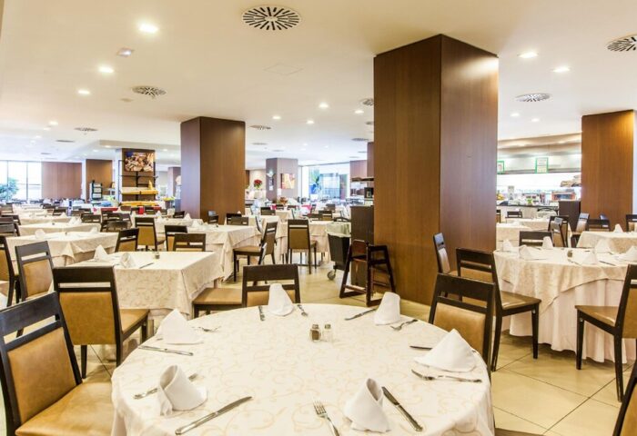 Gran Hotel Cervantes by Blue Sea dining area. Gay-friendly hotel restaurant with set tables and chairs. Interior view.