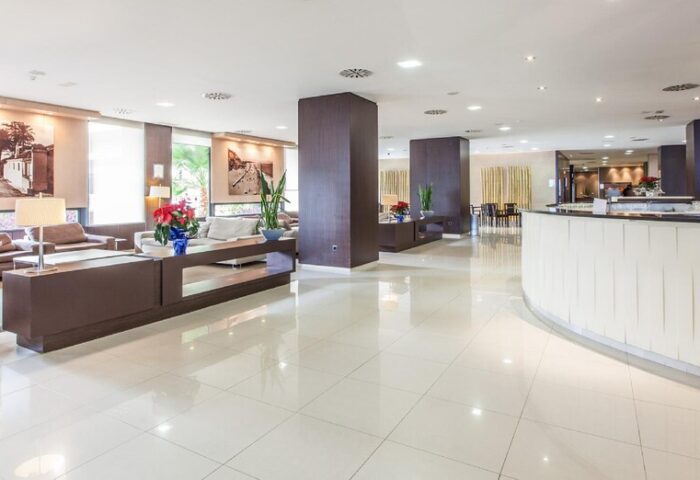 Gran Hotel Cervantes by Blue Sea lobby. Gay-friendly hotel with modern design, seating areas, and reception. Perfect for gay travel.