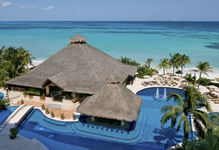 Grand Fiesta Americana Coral Beach Cancun all-inclusive gay-friendly hotel aerial view. Pool bar, beach, and turquoise ocean.