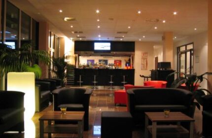 Grand Hotel Dream Main City Center lounge area. Gay-friendly hotel with a bar, seating, and modern design. Perfect for gay travelers in the city center.