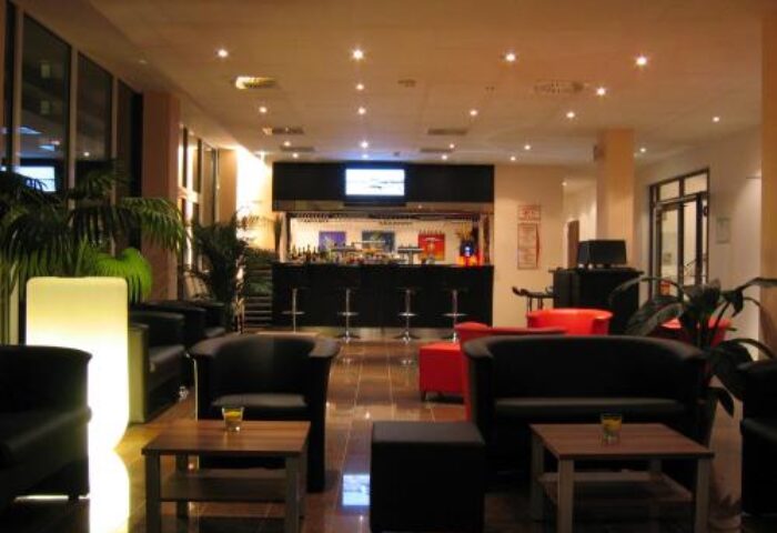 Grand Hotel Dream Main City Center lounge area. Gay-friendly hotel with a bar, seating, and modern design. Perfect for gay travelers in the city center.