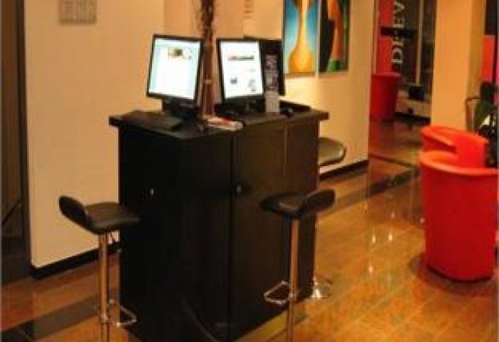 Grand Hotel Dream Main City Center's business center. Two computers and stools. A gay-friendly hotel in a prime location.