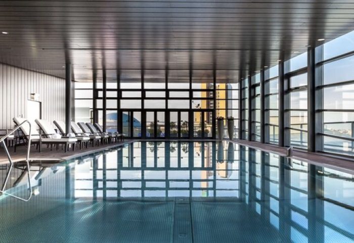 Indoor pool at the gay-friendly Grand Hyatt Berlin hotel. Relaxing space for gay travelers. Modern design, city views.
